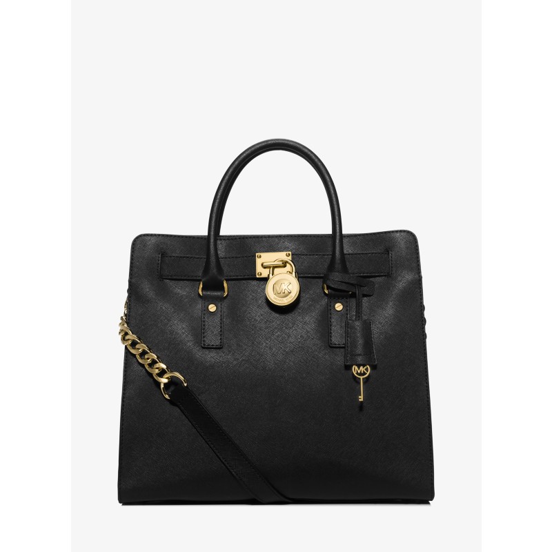 Black tote bag with two handles, a shoulder strap and a round lock detail; exact model and material unverified