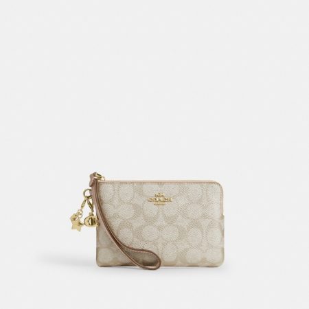 Coach Outlet Boxed Corner Zip Wristlet In Signature Canvas With Charms - Preorder — Brass/Champagne