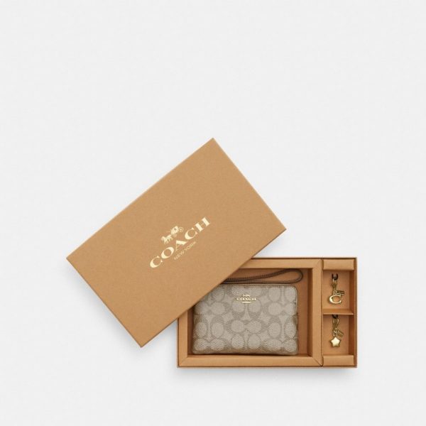 Coach Outlet Boxed Corner Zip Wristlet In Signature Canvas With Charms - Preorder